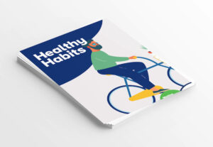 The front cover of a workbook called healthy habits. Includes an image of a man on a bicycle.